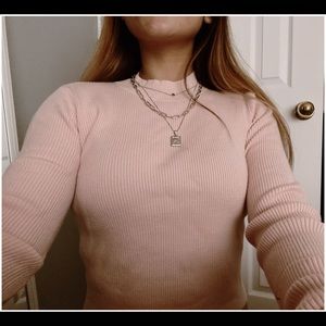 Baby pink turtleneck from Brandy Melville